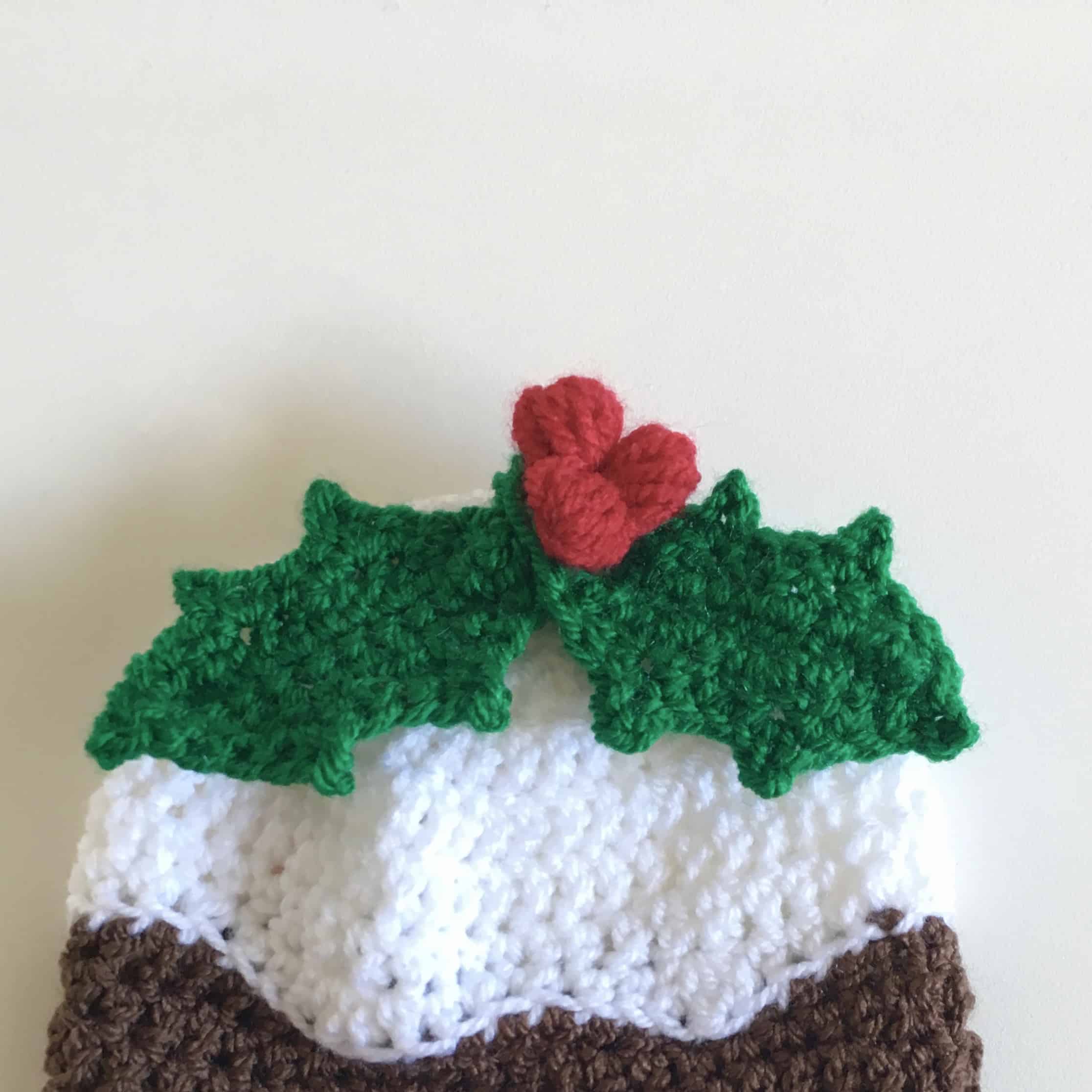 Christmas pudding crochet hat with holly sprig and berries