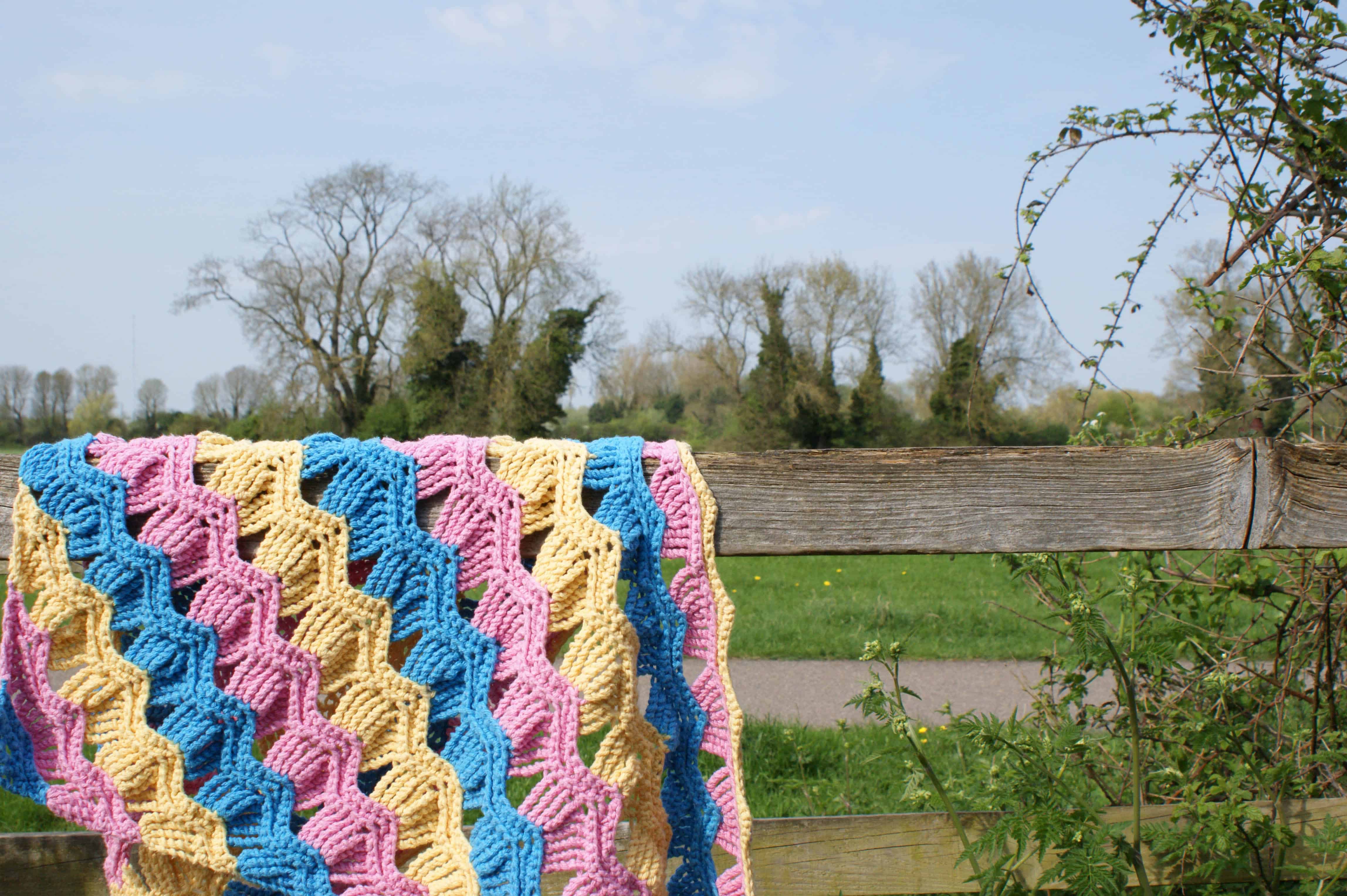 pink blue and yellow crochet shawl