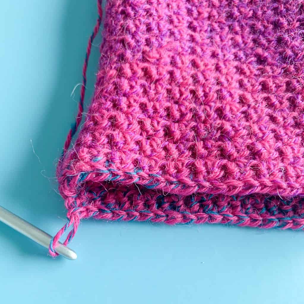a close up of a crochet sock tube