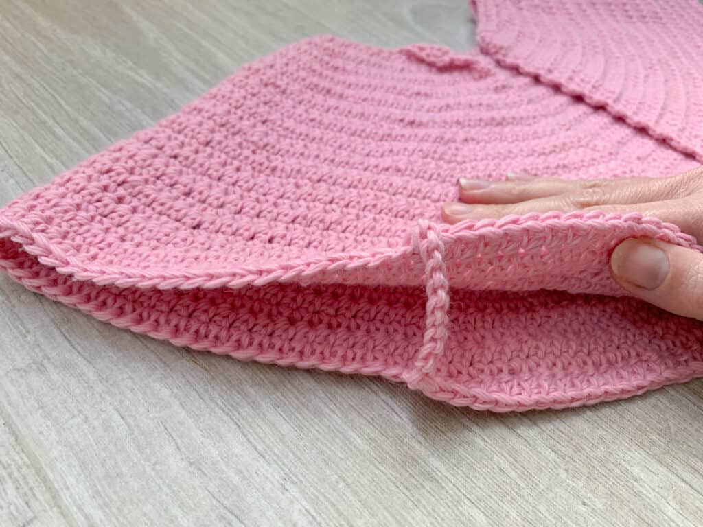 The underarm chain of a top down crochet cardigan after the yoke has been split.