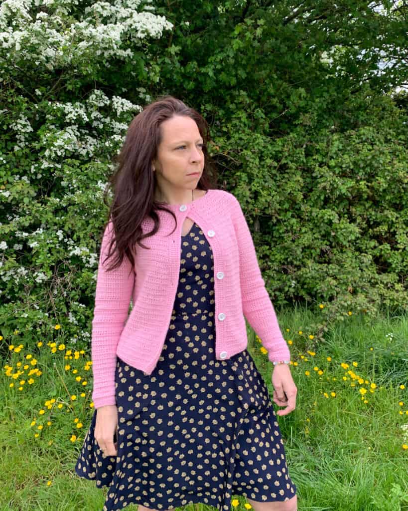 The any time crochet cardigan is buttoned at the top only and paired with a swing dress for that 50s feel.