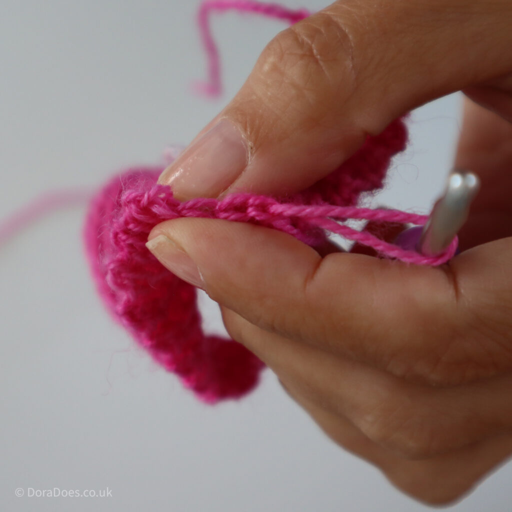 A close up of the final three stitches of a mitres square in which a single crochet 3 together will be crocheted.