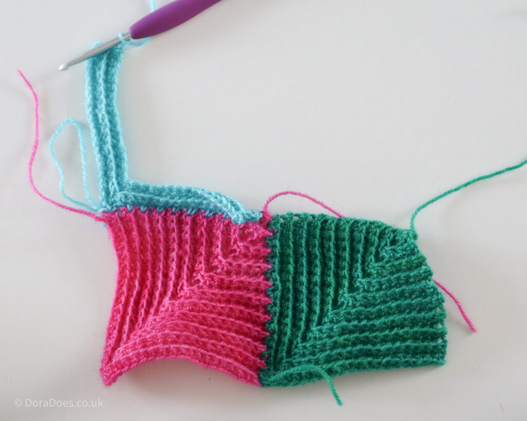Crochet mitred square step by step joining tutorial showing the third square after three complete rows.
