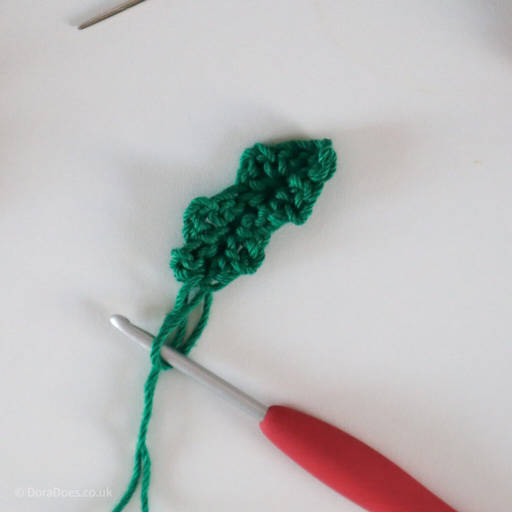Crochet Holly Leaf tutorial showing the completed holly leaf before fastening off.