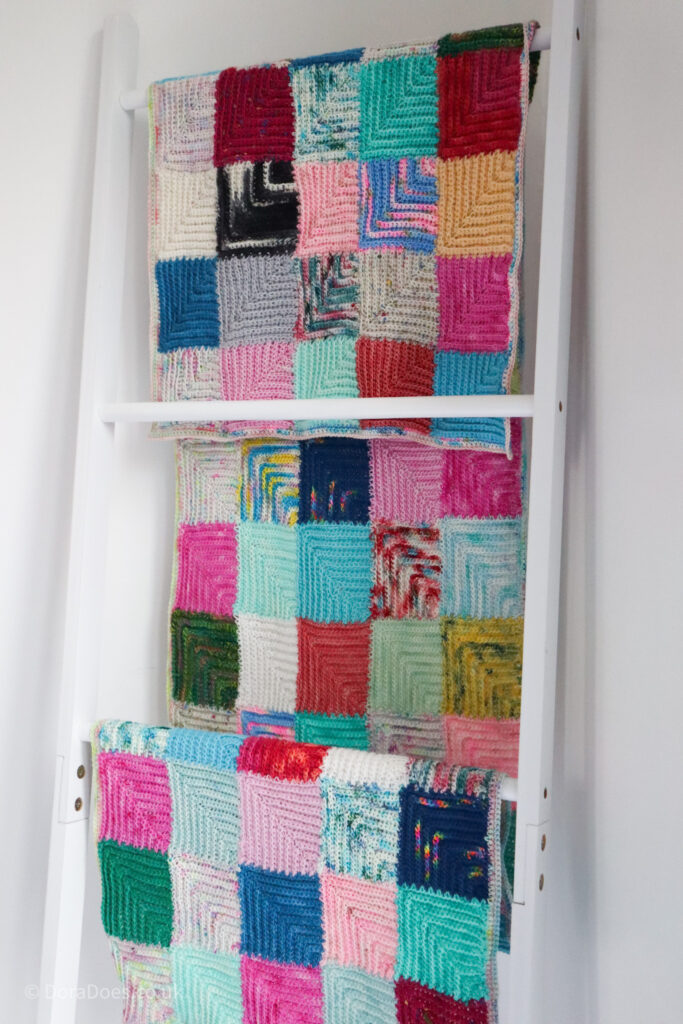 The mitred minis wrap is hun looped over a blanket ladder.