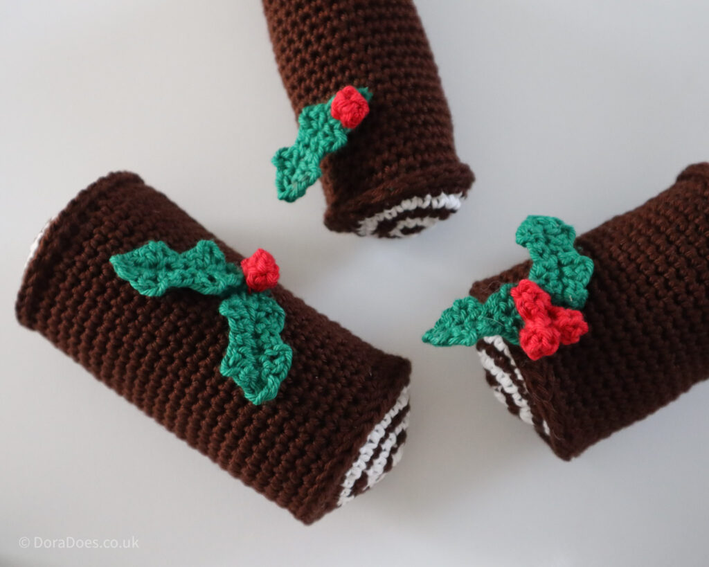 Three crochet Yale log decorations seen from above.