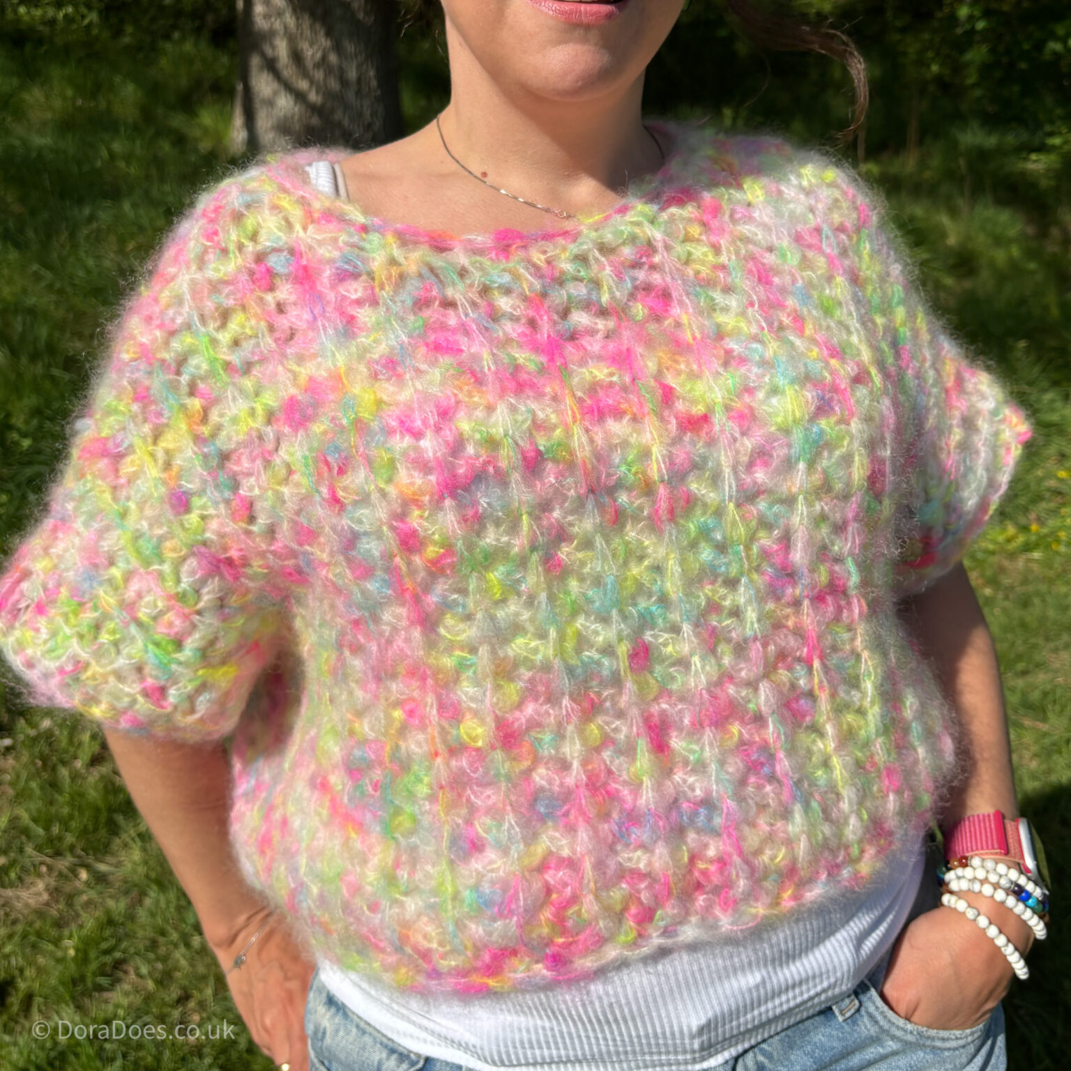 A close up of the squish it sweater. An oversized, cropped crochet sweater with a ribbed stitches made from a fluffy mohair yarn.