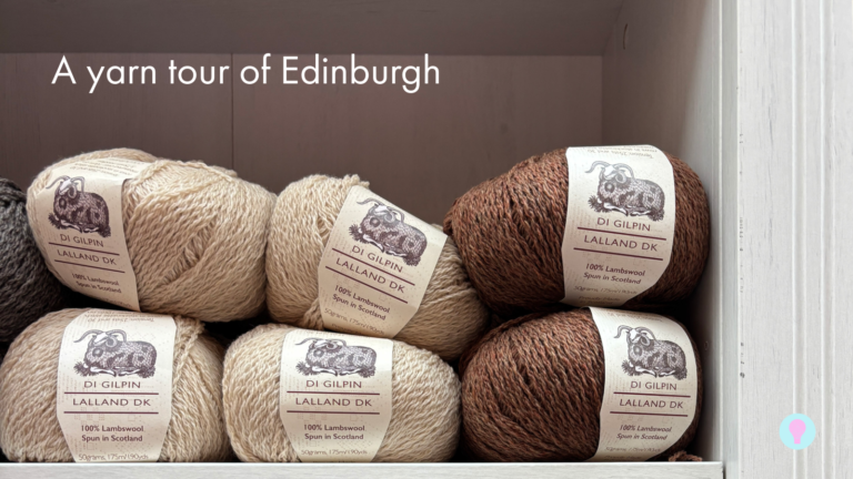 A shelf of naturally coloured balls of yarn with the Di Gilpin label on. A text overlay reads ‘yarn tour of Edinburgh.’